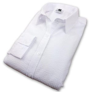 May include: White long-sleeved button-down shirt with a textured waffle weave pattern. The shirt has a classic collar and button cuffs.