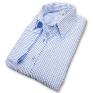 May include: A light blue and white gingham button-down shirt with a collar and long sleeves. The shirt is folded and laid flat on a white background.