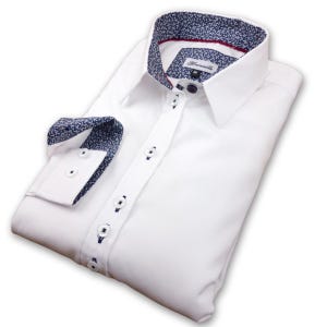 May include: White long-sleeved dress shirt with a button-down collar and a navy blue and white patterned inner collar and cuffs. The shirt has a label that says "Remarkable" on it.
