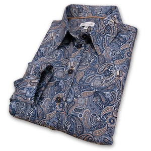 May include: A long-sleeved shirt with a button-down collar, featuring a blue and brown paisley pattern.