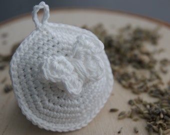May include: White crocheted lavender sachet with a bow detail.