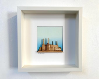 Battersea Power Station made from layered wood with blue sky background