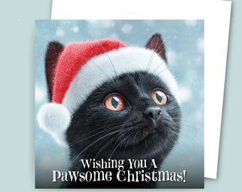 May include: A Christmas greeting card featuring a black cat wearing a Santa hat. The cat has bright orange eyes and is set against a snowy background. The card reads "Wishing You A Pawsome Christmas!"