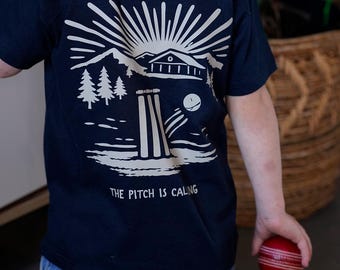 the cricket pitch is calling children's t shirt | matching family cricket tops