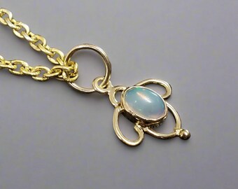 Ethiopian Opal 18k Gold Pendant: Oval Cabochon Charm