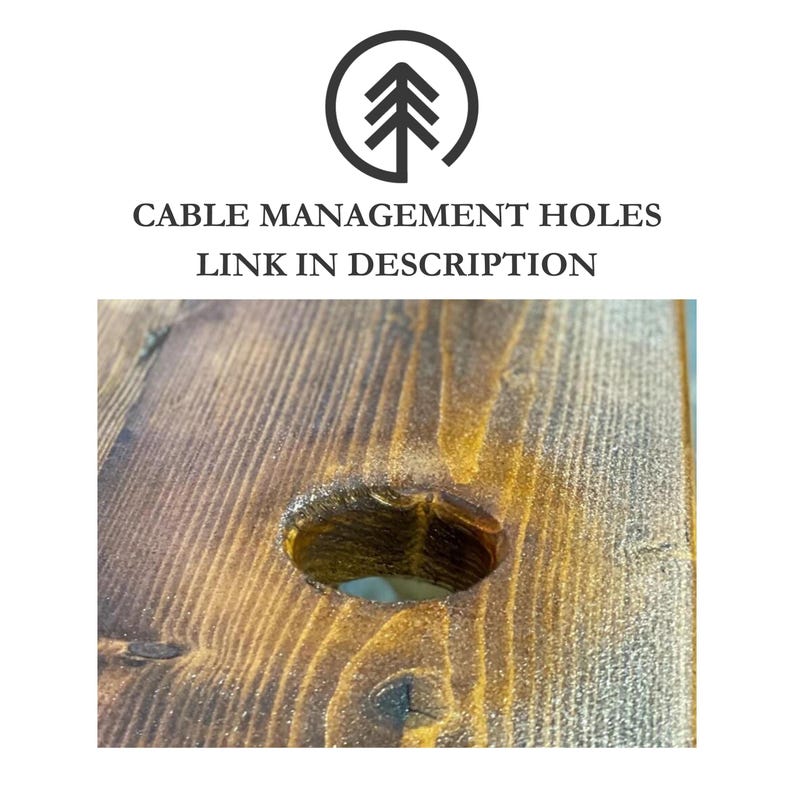 Close-up of a wood surface with a round hole drilled through it. The hole is approximately 6cm in diameter and has a rounded edge. The wood is a dark brown colour and has a natural grain pattern.