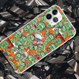 May include: A colorful phone case with a graphic design of green and black cartoon characters. The case features a variety of characters with different expressions and poses. The text "I Need Brain" is visible on the case.