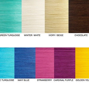 May include: A collection of twelve colored cords arranged in two rows. The top row features black, green turquoise, winter white, ivory/beige, chocolate, and olive green. The bottom row displays silver/gray, blue turquoise, navy blue, strawberry, cardinal purple, golden yellow, and red.