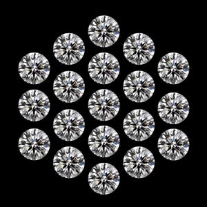 May include: Twenty-one round, brilliant-cut diamonds are arranged in a circular pattern against a black backdrop. The diamonds sparkle with multiple facets, reflecting light. The image showcases the clarity and brilliance of the gemstones.