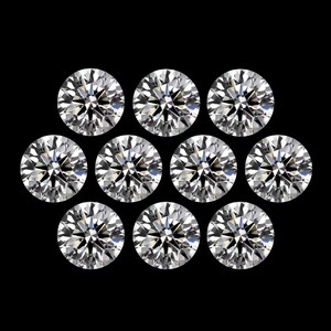 May include: Ten round-cut diamonds are displayed against a black backdrop. Each diamond has multiple facets, reflecting light and creating a sparkling effect. The image highlights the clarity and brilliance of the gemstones, showcasing their quality.