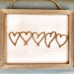Handschriftcadeau | Hartuitsparingen | Aangepast handschriftteken | Familieherinnering | Houten bord | Handschrift moeder | Handschrift kinderen | Herdenkingscadeau