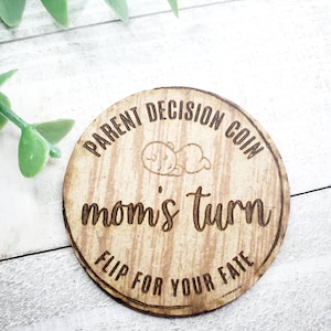 May include: A wooden coin with the text "Parent Decision Coin" and "Mom's Turn" on it. The coin also has the text "Flip for your fate" on it.