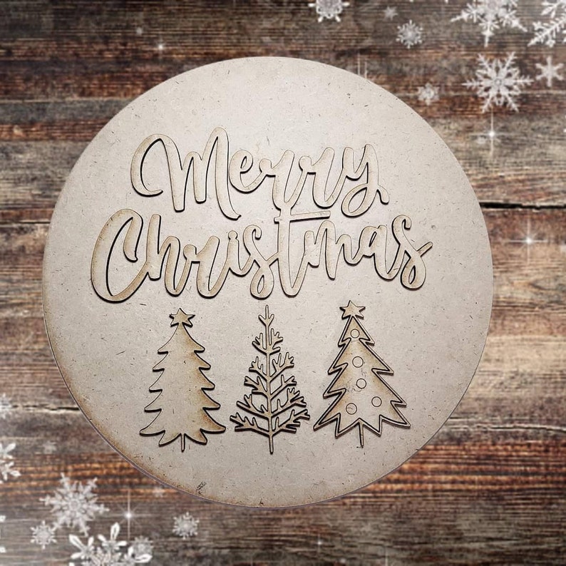 May include: A round wooden sign with the words "Merry Christmas" in a decorative font. Three stylized Christmas trees are below the text.