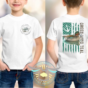 May include: White t-shirt with a green-winged teal duck on an American flag design on the back. The front of the shirt has a small logo that says "Duck Hunter Outfitters".