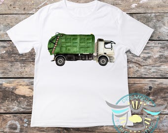 May include: White t-shirt with a green and white garbage truck graphic. The truck has a green dumpster and a white cab.