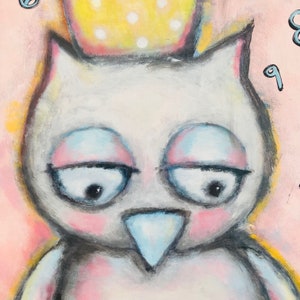May include: A white owl with a yellow crown on its head. The owl has blue eyes and a pink beak. The background is pink.