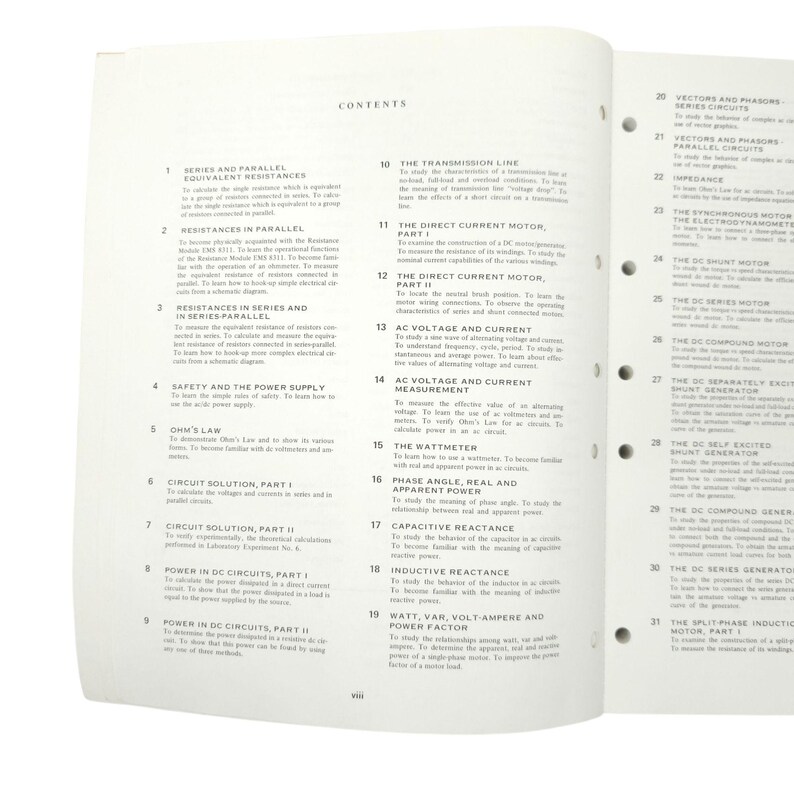 May include: Open textbook page with a table of contents listing topics like "Series and Parallel Equivalent Resistances" and "The Direct Current Motor." The text is black on a white background. The book is open to a double-page spread.