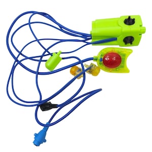 May include: A neon green and yellow toy with a blue cord. The toy has a red light and two small yellow lights. The cord has a blue connector and a black connector. The toy is on a white background.