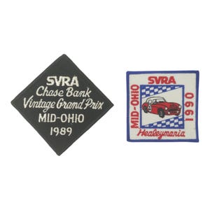 May include: Two embroidered patches. One is a black diamond shape with white text: "SVRA Chase Bank Vintage Grand Prix MID-OHIO 1989." The other is a square with a red car, text "SVRA MID-OHIO 1990 Healeymaria."