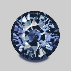 May include: A round, faceted, blue sapphire gemstone with a starburst pattern.