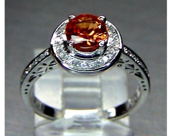 Ladies 14 karat white gold untreated Montana VS intense orange 1ct. round brilliant cut sapphire and diamond  halo engagement ring