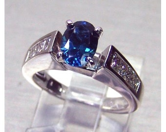 Ladies custom designed 14 karat white gold untreated top Montana VVS blue sapphire and diamond  engagement ring