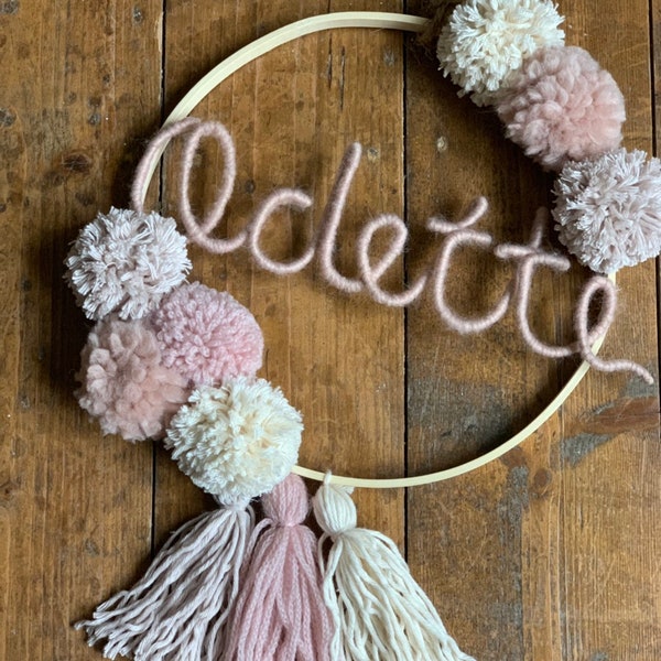 Name ring with pompom and tassels