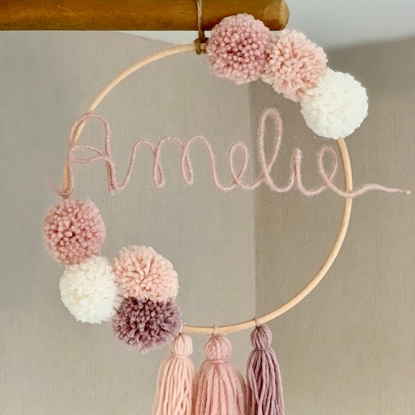 Name ring with bobbles and tassels