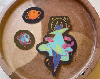 Galaxy Cat Astronaut Sticker: Whimsical Space Planets