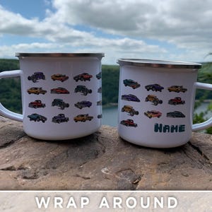 May include: Two white enamel mugs with a wrap-around design of colorful cartoon cars. The mug on the left has a design of cars all over the mug. The mug on the right has a design of cars on the front and the word "NAME" on the bottom.
