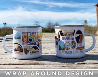 May include: White enamel camping mug with a wrap-around design featuring colorful illustrations of American National Parks. The mug has a black handle and a silver rim. The text "American National Parks" is printed on the mug.