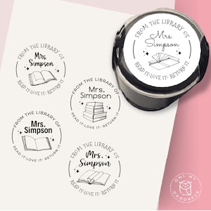 May include: A black and white stamp with the text "FROM THE LIBRARY OF Mrs. Simpson READ IT LOVE IT RETURN IT" encircling a book illustration. The image includes multiple stamp impressions and a stamp.
