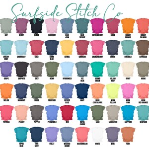 May include: A color chart of t-shirts from Surfside Stitch Co. The shirts are displayed in rows and columns, showcasing a variety of colors such as black, blue, pink, orange, and green. Each shirt has a color name label, including "Banana," "Berry," and "Black."