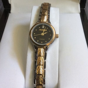ELGIN II Women s Watch Round Black Dial Gold Indices and a 12th