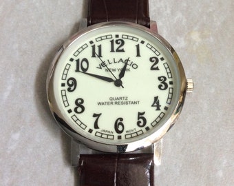 VELLACIO Men's Silver Watch Round Glow in the Dark Dial Easy to Read Numbered Hours on a Brown Leather Band New Unused Vintage item!