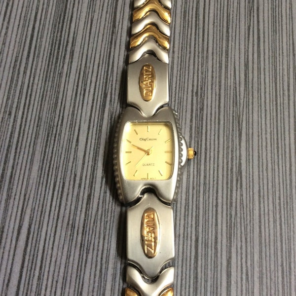 Vintage Rare Women's Oleg Cassini Two Tone Watch Rectangle Gold Dial on Gold Index Hours on Two Tone Linked Band In Mint Un-used Condition!