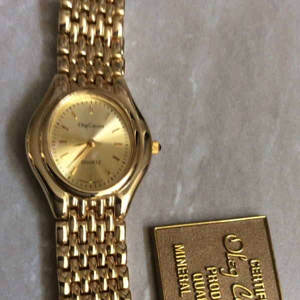 Oleg Cassini Men's Gold Watch Oval Dial with index Hour Marker's on a Unique Gold Linked Band Vintage Watch in New Mint Condition, Rare!