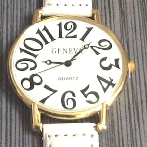 Geneva Women&#39;s Round Watch Big Hour Numbers on a White Leather Band New Un-used Vintage Watch, Ready to be Cherished!