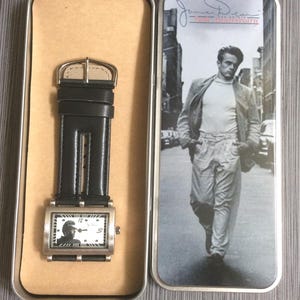 James Dean Men&#39;s Silver Watch Rectangle White Dial James Dean Image, all on a Black Leather Band New Un-Used Vintage Collectible in Box!