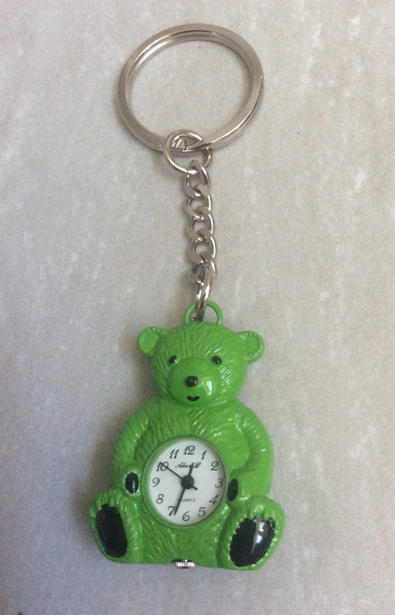 Lovely Green Teddy Bear Keychain having a Round Wh