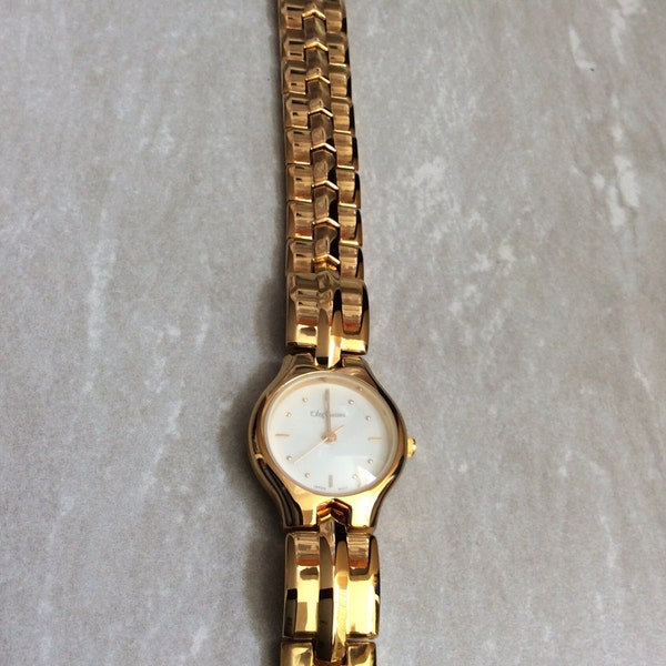 Oleg Cassini Women's Gold Watch Having a Round White Easy to Read Dial on Gold Linked Band Vintage Mint Condition High Quality Watch.