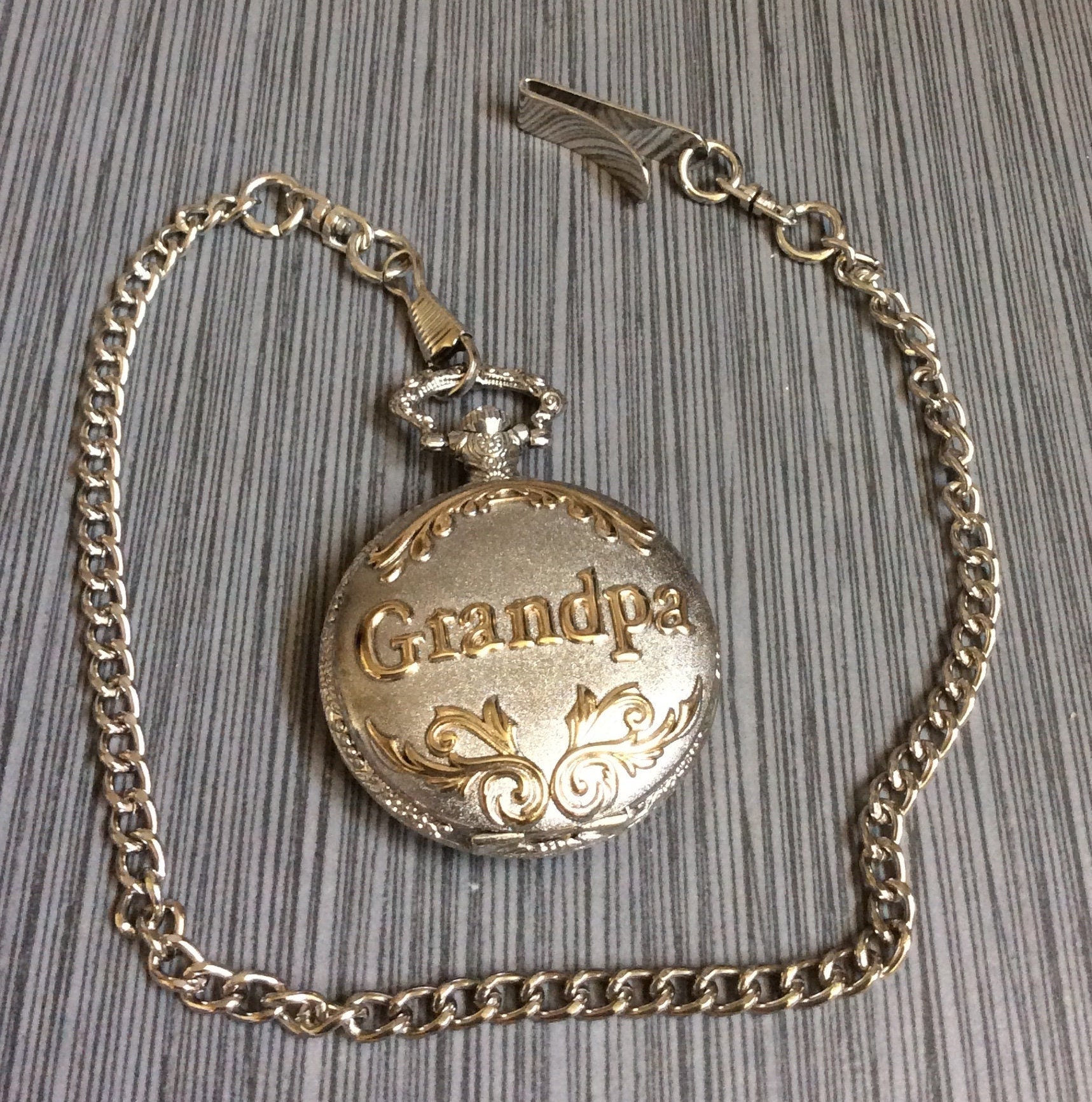Two tone grandpa Pocket Watch Opens to a Round Silver Dial