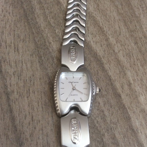 Oleg Cassini Women's Silver Watch Having a Rectangle Easy to Read Dial on Silver Linked Band Vintage High Quality New Watch.