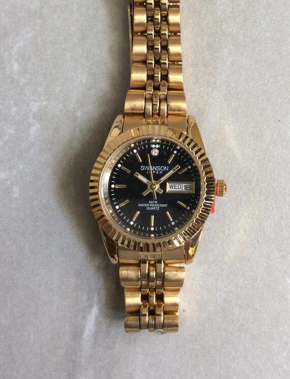 SWANSON Gold Women's Watch Round Black Dial Index Hours Day & Date
