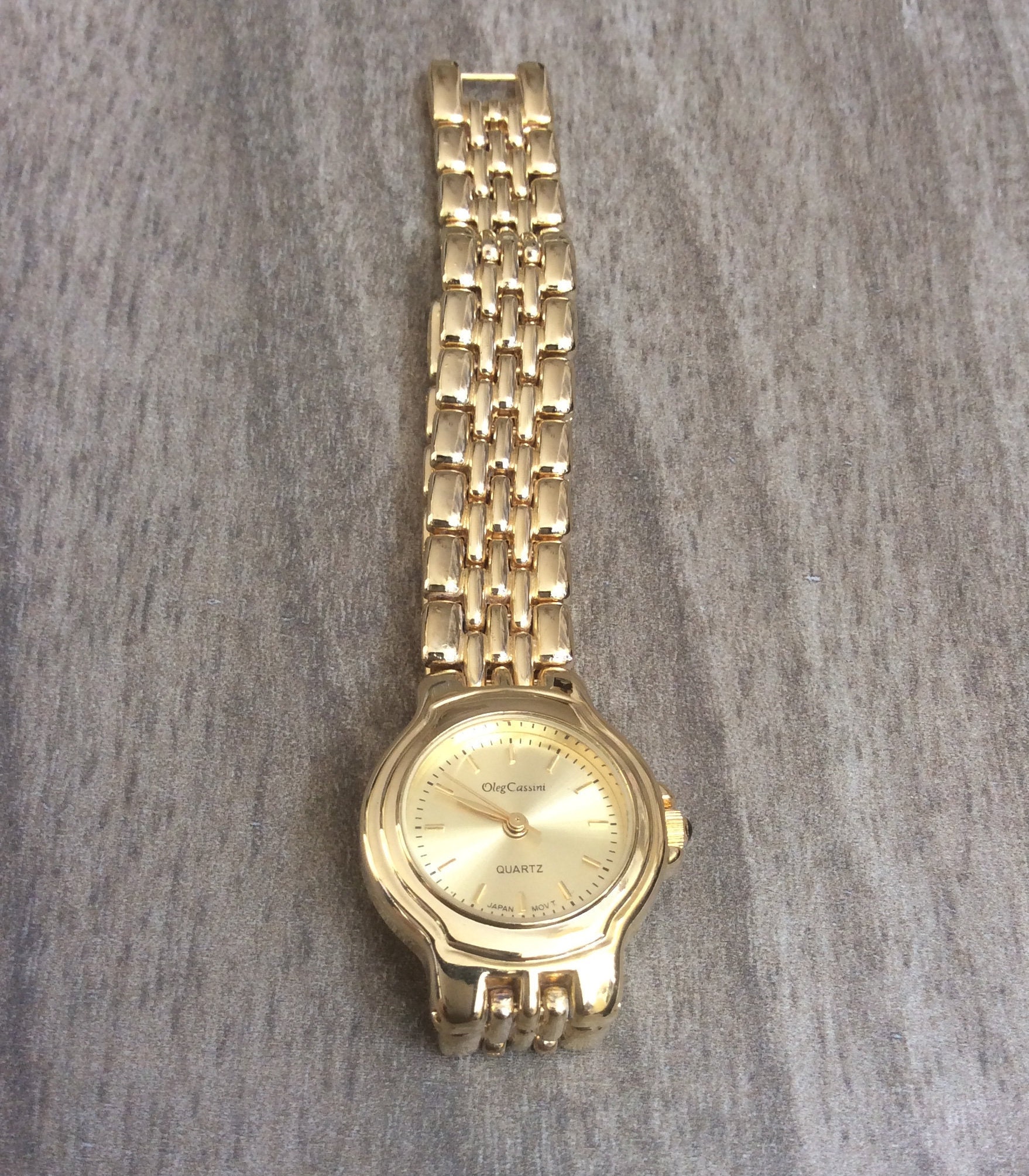 Oleg cassini gold quartz watch hot sale