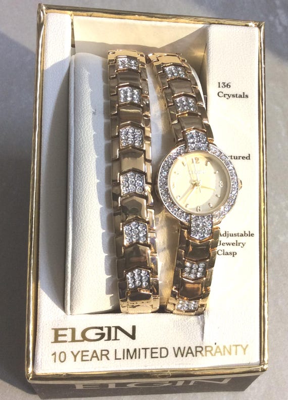 ELGIN Women's Gold 136 Crystals Watch Round Gold Dial on Crystal
