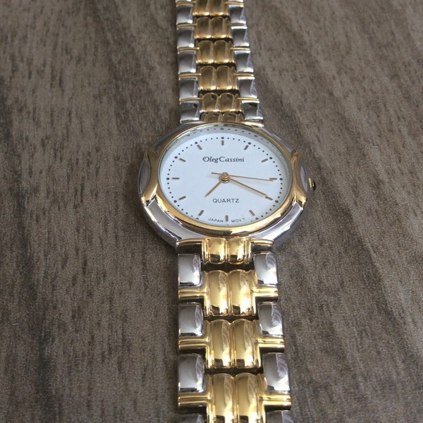 Oleg Cassini Men's Watch Round White Dial with Index Hour Markers on a Two-Tone linked Band Vintage in New Mint Condition Watch!