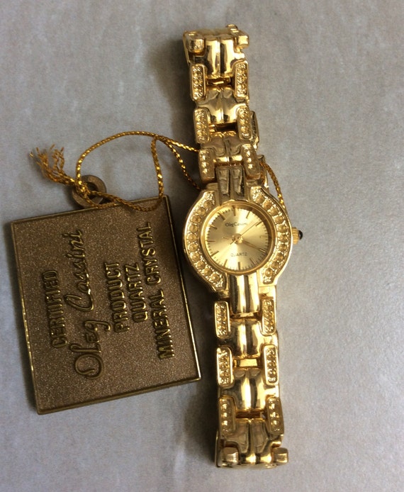 Oleg Cassini Reloj de oro para mujer, esfera redonda de oro con banda  enlazada a juego, reloj vintage poco común en nuevas condiciones. - Etsy  España