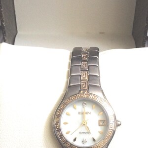 Elgin Women&#39;s Crystal Watch Round Pearl Dial with Date, Displaying Crystal & Index Hour Markers all on a Two Tone Linked Band New/Vintage!