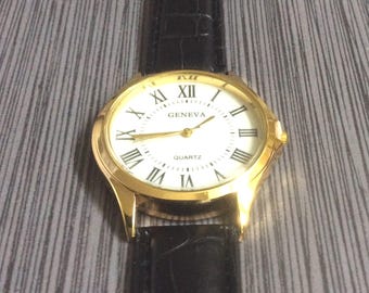 Geneva Men&#39;s Watch Gold Case Round White Dial Black Roman Numeral Hours on Black Leather Band New Unused Vintage Watch!